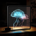 Écran holographique 3D OVA affichant des méduses bleue et rose sur un bureau
